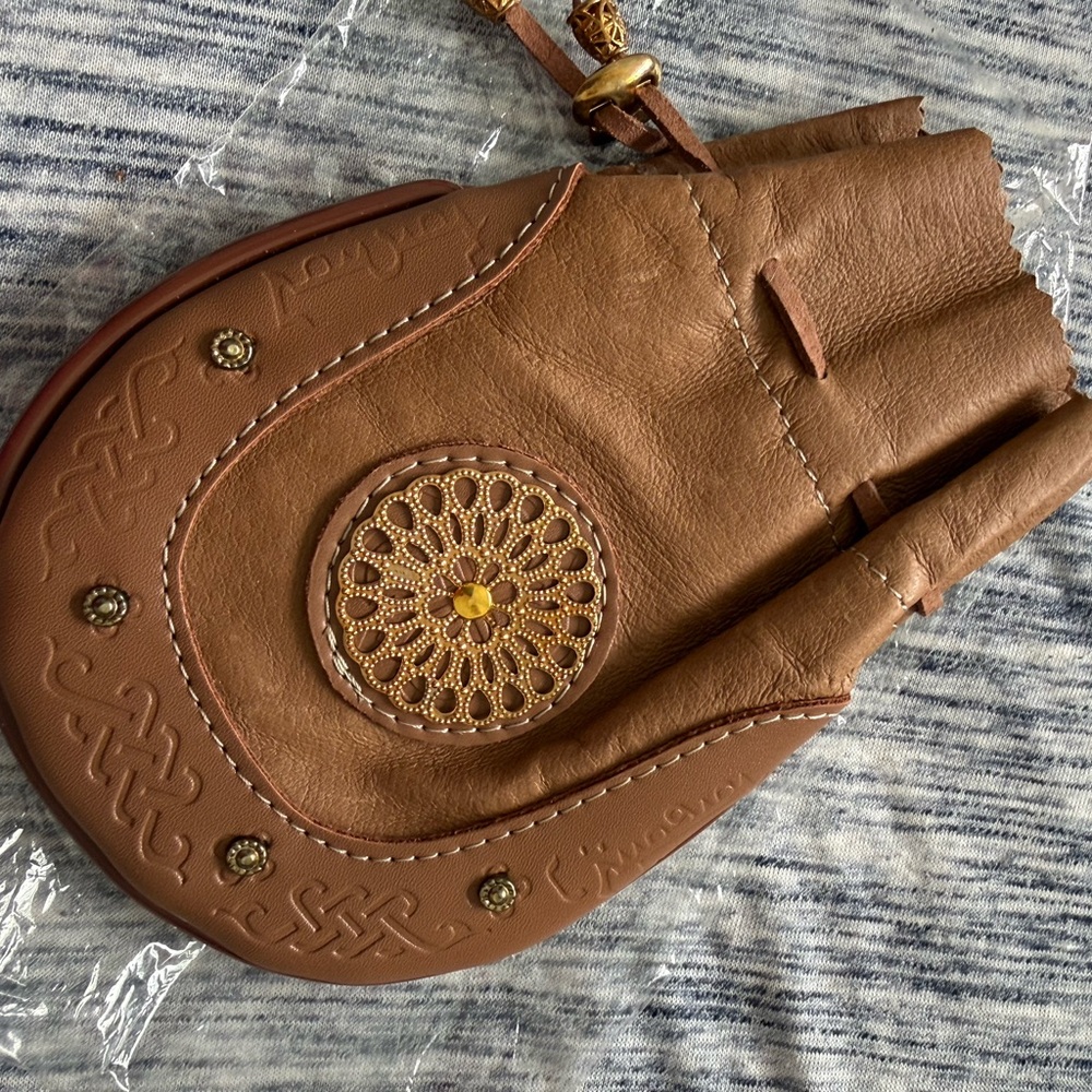 Brown leather pouch with Decorative Medallion